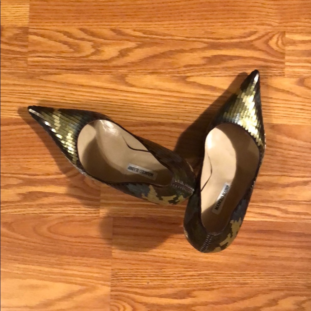 A pair of army fatigue sequin Manolo Blahnik heels